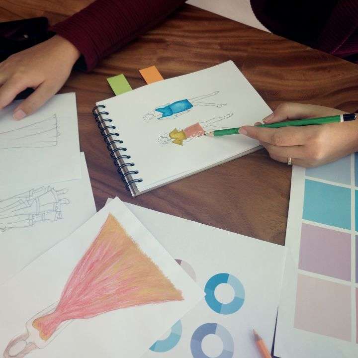 A fashion designer preparing some sketches of her design ideas
