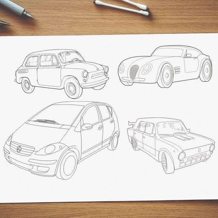 A paper on the table with different sketches of cars