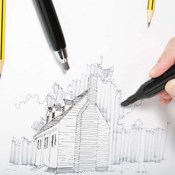 A simple line drawing of a house with scenery on a sketch pad