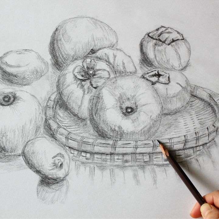 Charcoal drawing of different fruits in a basket