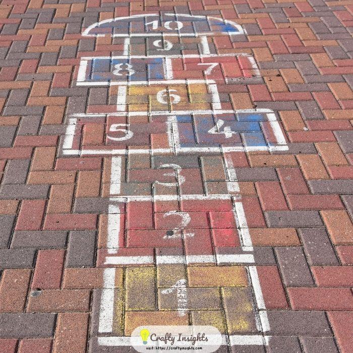 classic hopscotch grid with colorful squares and numbers chalk art